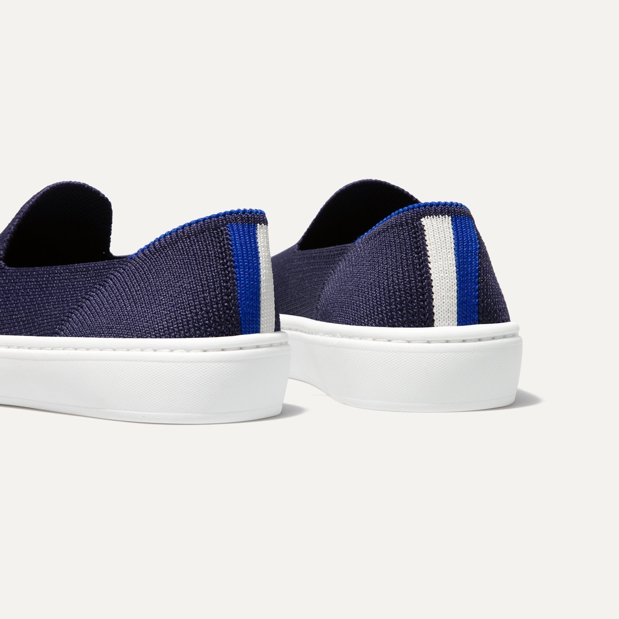 hover | The Kids slip-on Sneaker in Deep Navy shown from the back view with the heel detail.