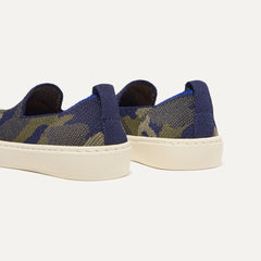 Close up of the heel of The Kids Sneaker in Spruce Camo, with shimmery gold pull tab.