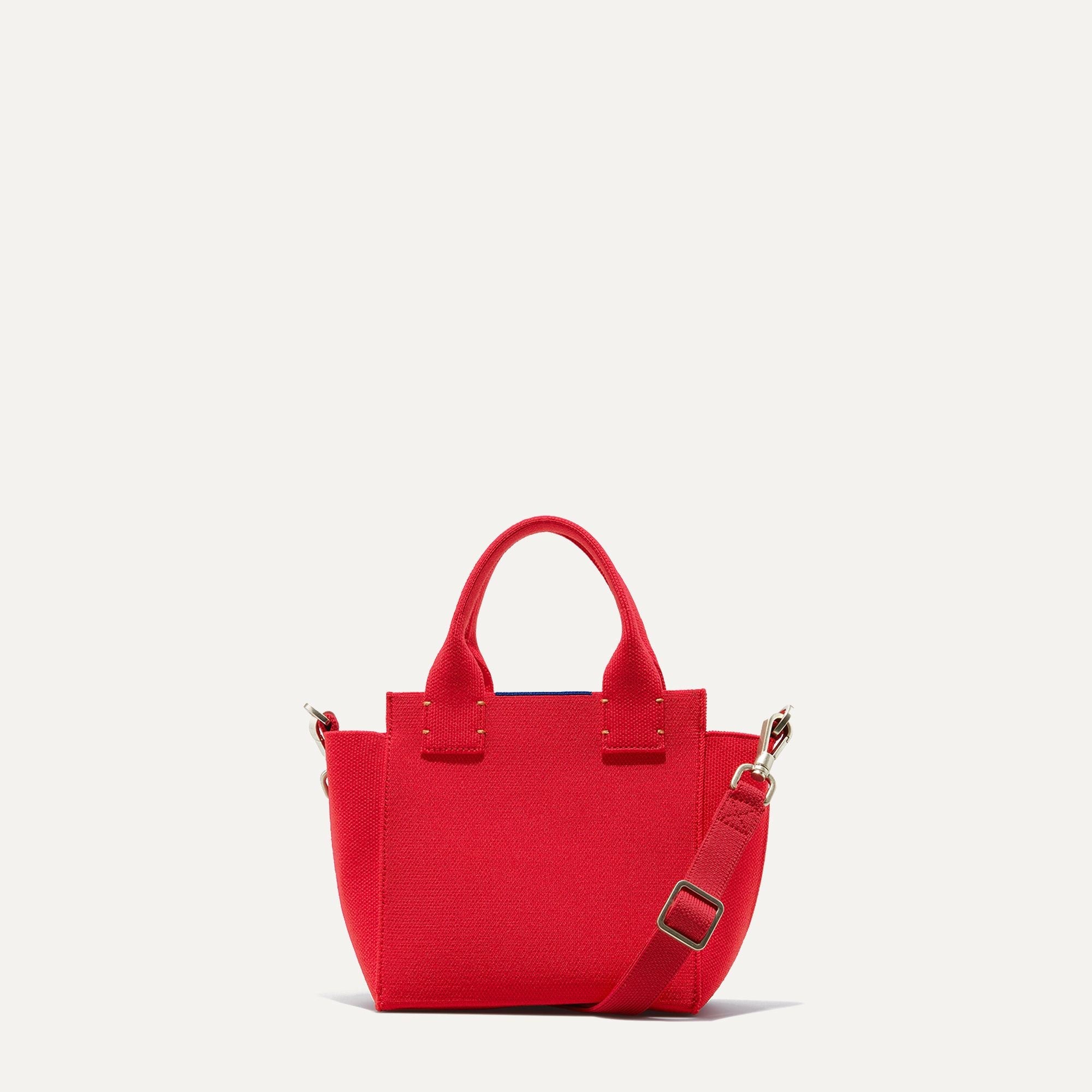 PLP |The Mini Handbag in Candy Apple shown from the front.