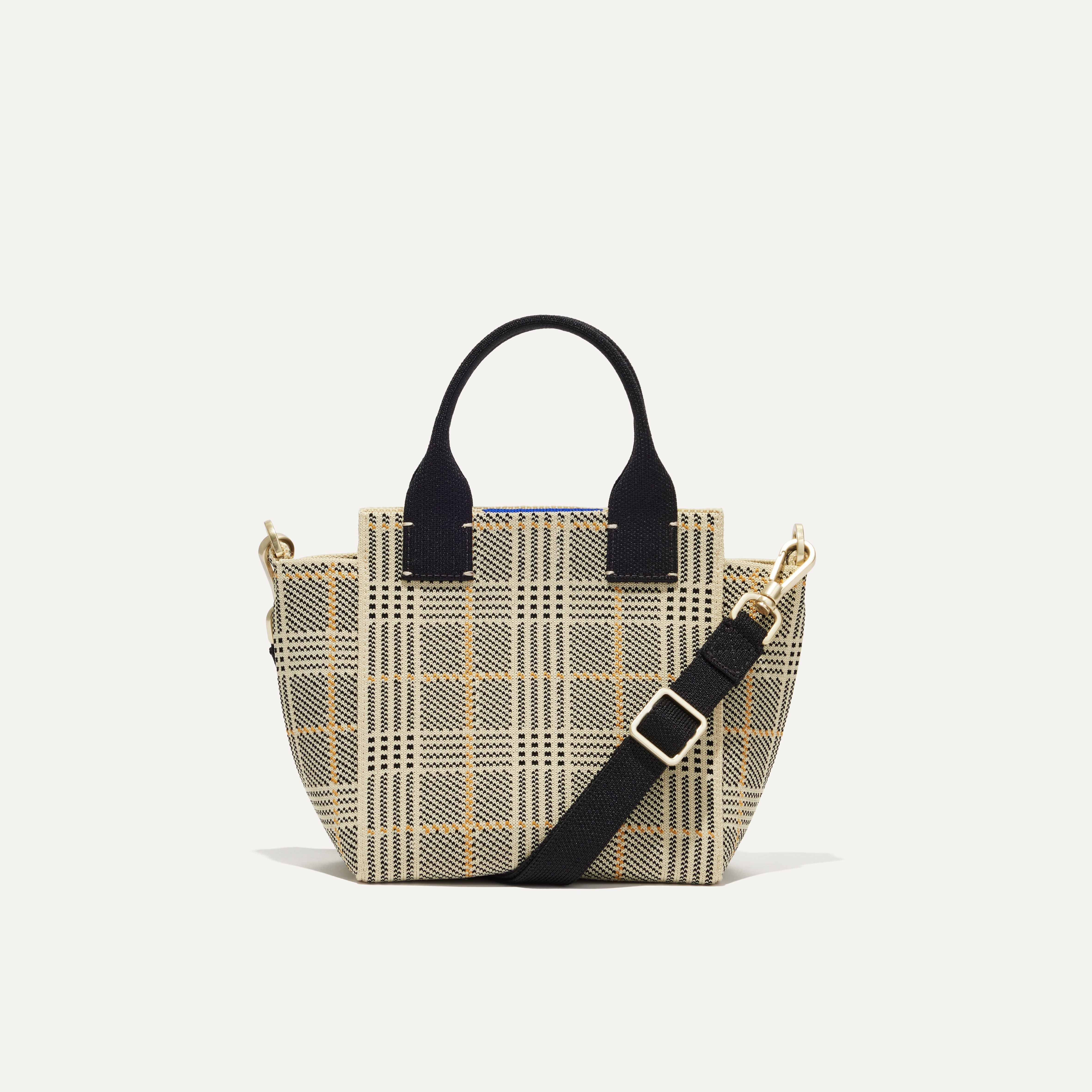 PLP |The Mini Handbag in Ivory Glen Plaid shown from the front.