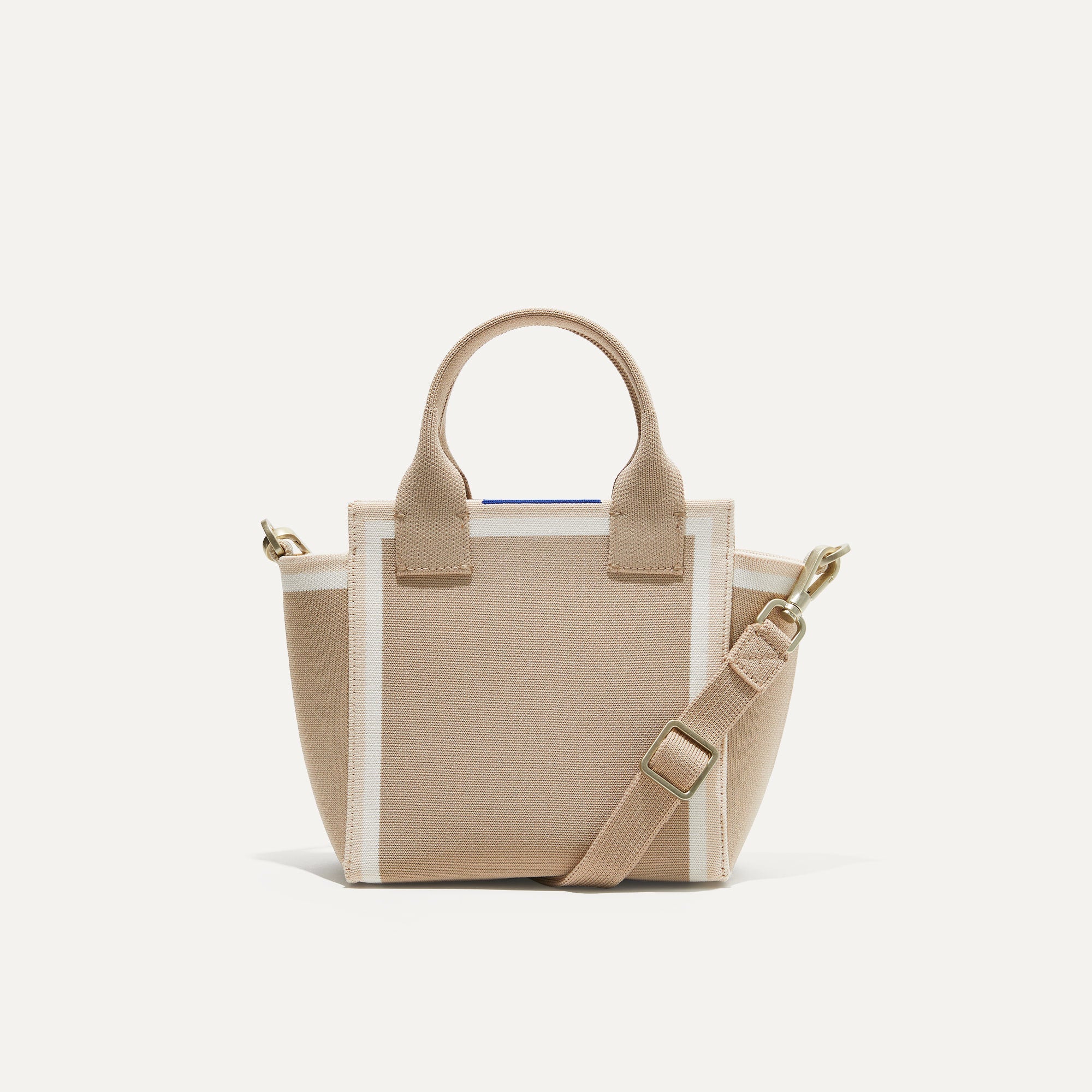 PLP |The Mini Handbag in Light Sesame shown from the front.