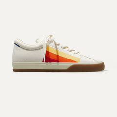 The Lace Up sneakers in Yellow Candy Stripe shown from a side view showing the outsole.