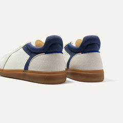 Close up of the heel of The RS01 Sneaker in hudson, with the padded ankle collar and Rothy's signature blue halo.