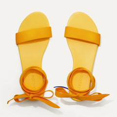 A pair of The Wrap slide sandals in Canary shown from the top view.