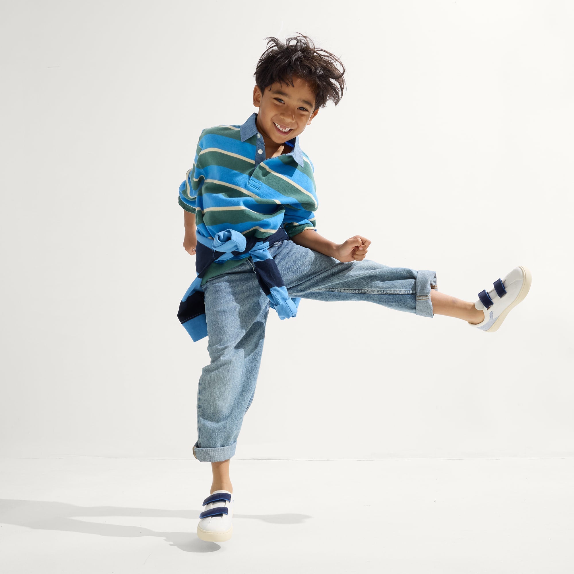 model | Alternate image of a boy modeling The Kids Strap Sneaker in Blue Raspberry. 