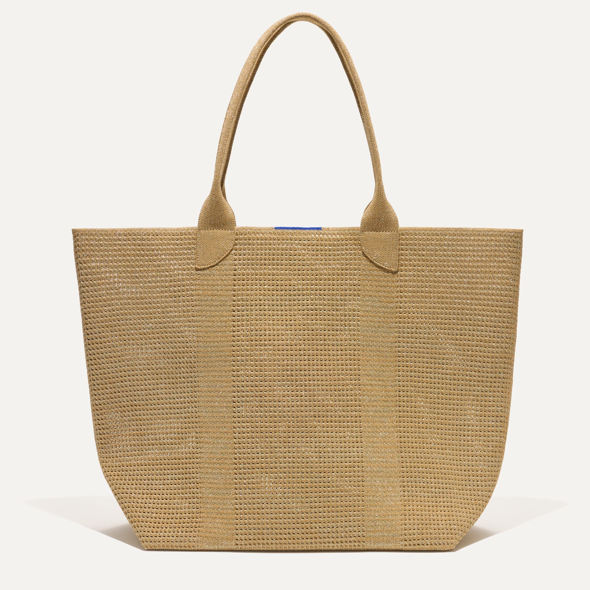 PLP |The Lightweight Tote in Golden Perf shown from the front. 