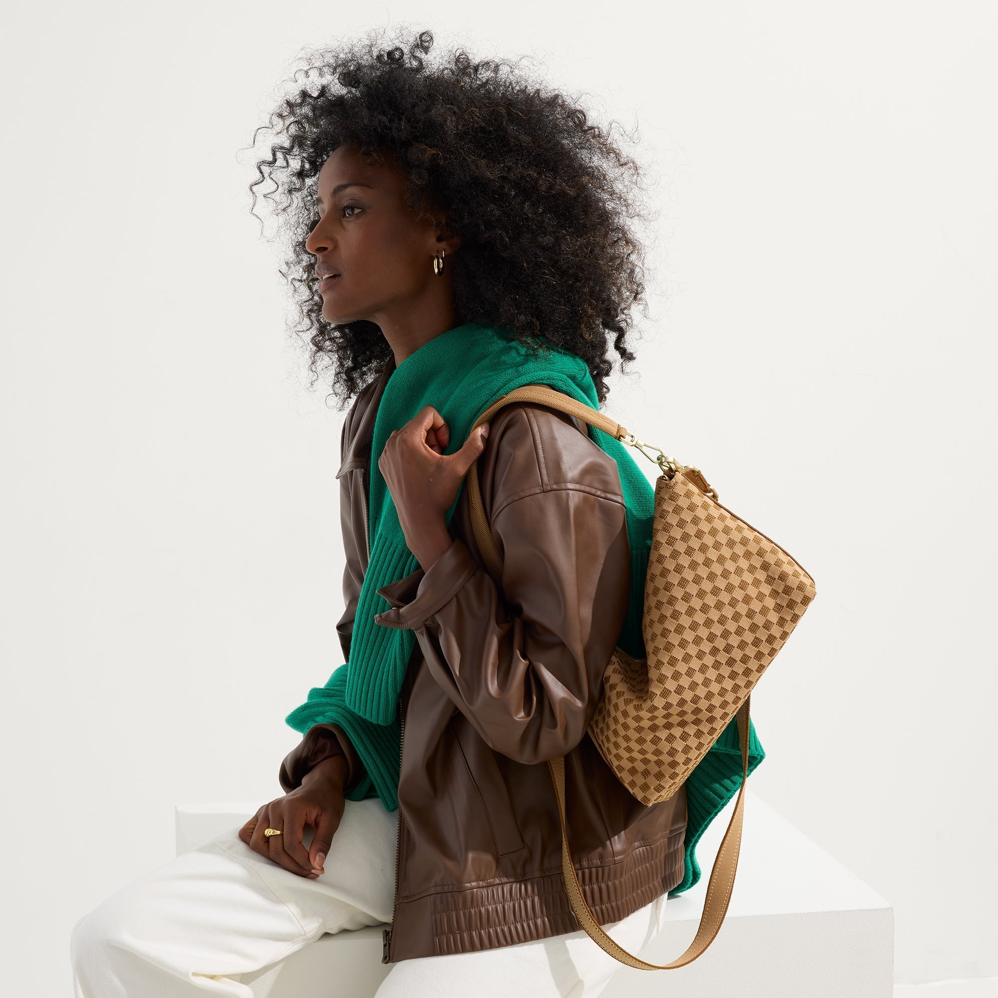 hover | The Daily Crossbody in Hazelnut, worn as a crossbody by a female model, shown from the front.