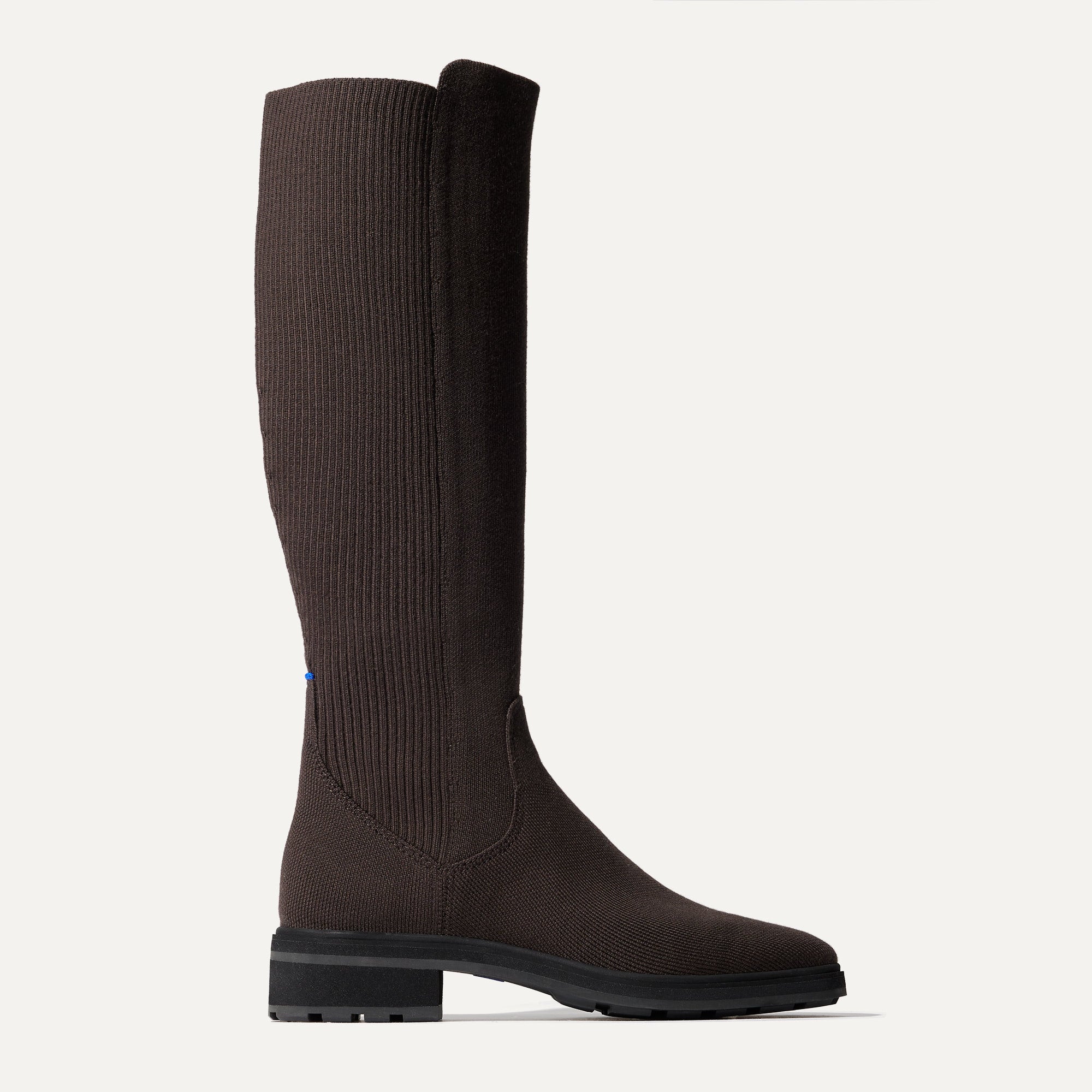 The Tall Lug Boot in Truffle Brown shown from the side. 