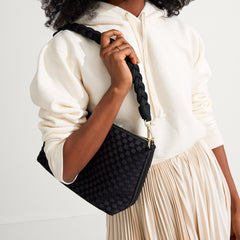 hover | The Braided Shoulder Strap in Black, shown paired with The Daily Crossbody, worn by a model and shown from the side. 