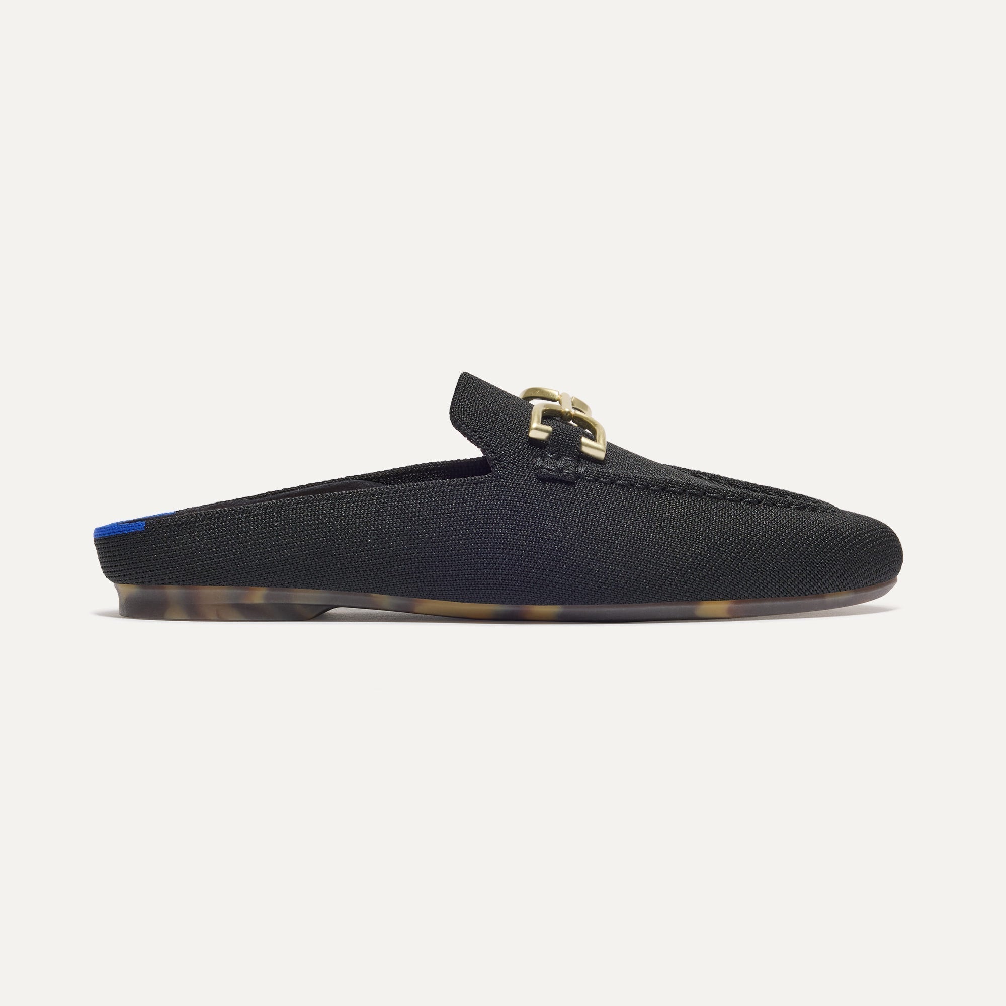 side | The Double Bit Loafer Mule in Black shown from the side.