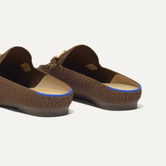 Close up of the heel of The Double Bit Loafer Mule in Cinnamon Raffia-Knit, with Rothy's signature blue halo. 
