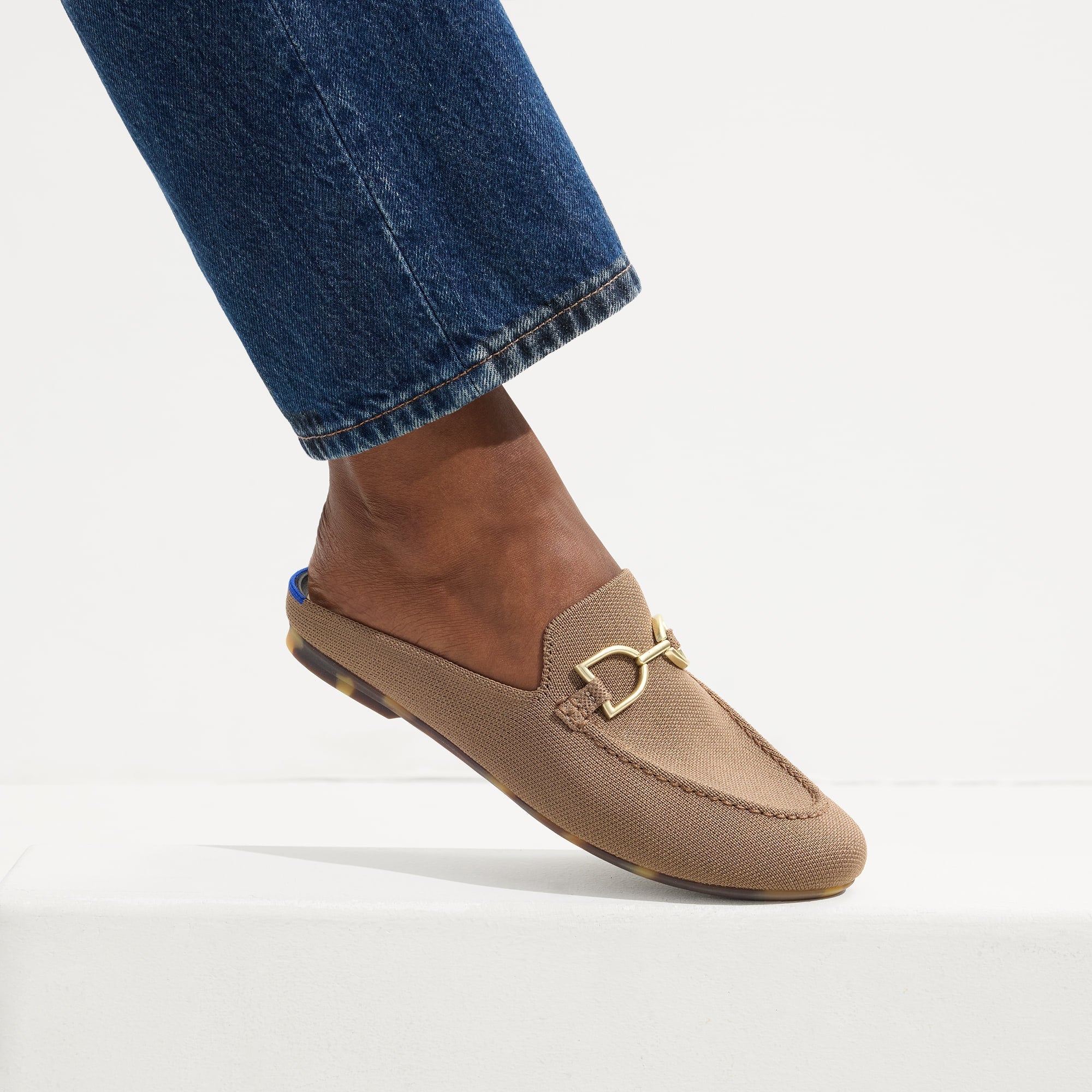 hover | Model wearing The Double Bit Loafer Mule in Portobello. 