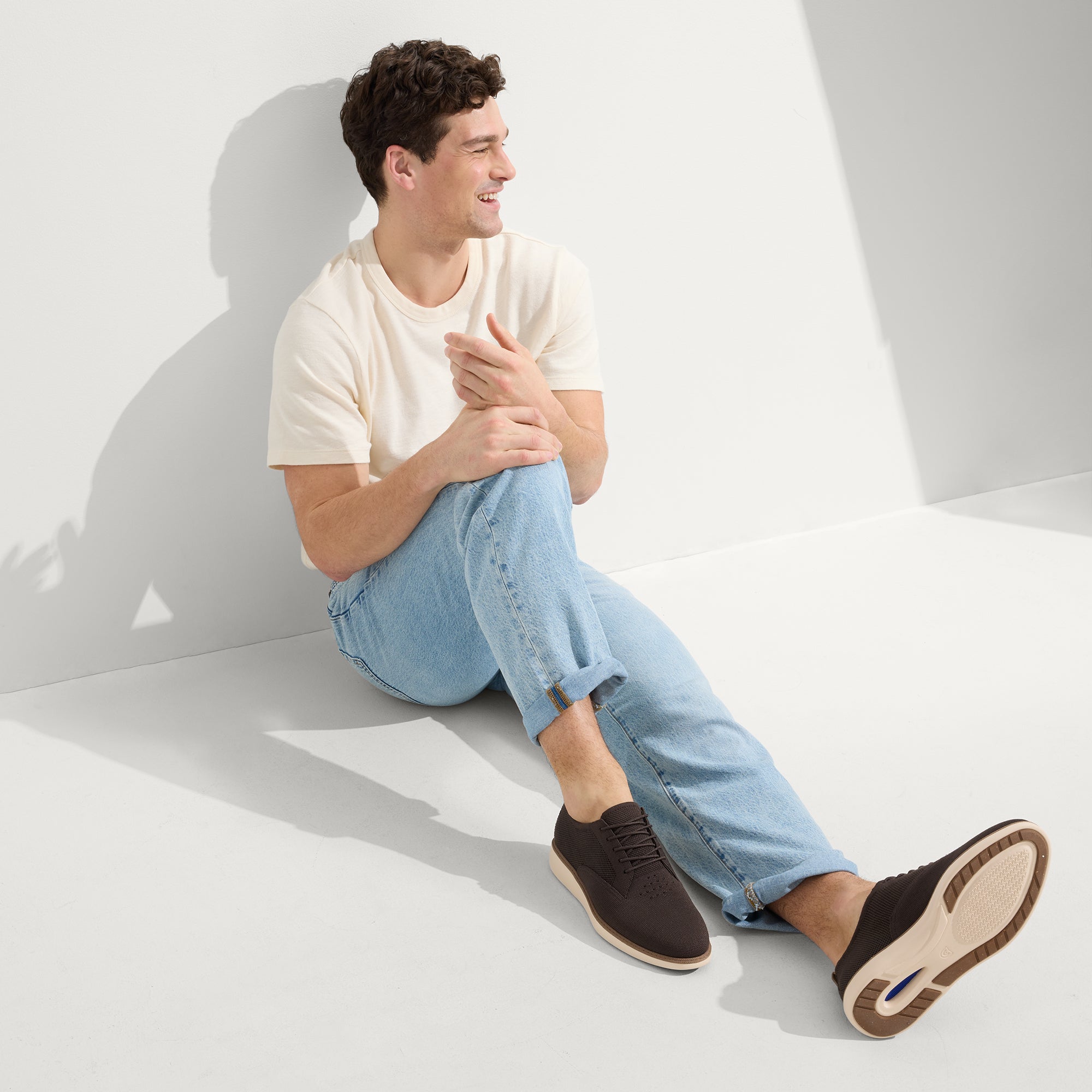 model | Alternate view of a model wearing The Oxford in Deep Brown. 
