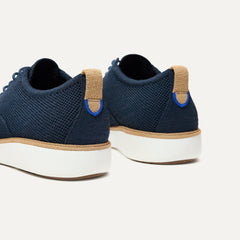 Close up of the heel of The Oxford in Night Navy, with Rothy's signature blue halo. 