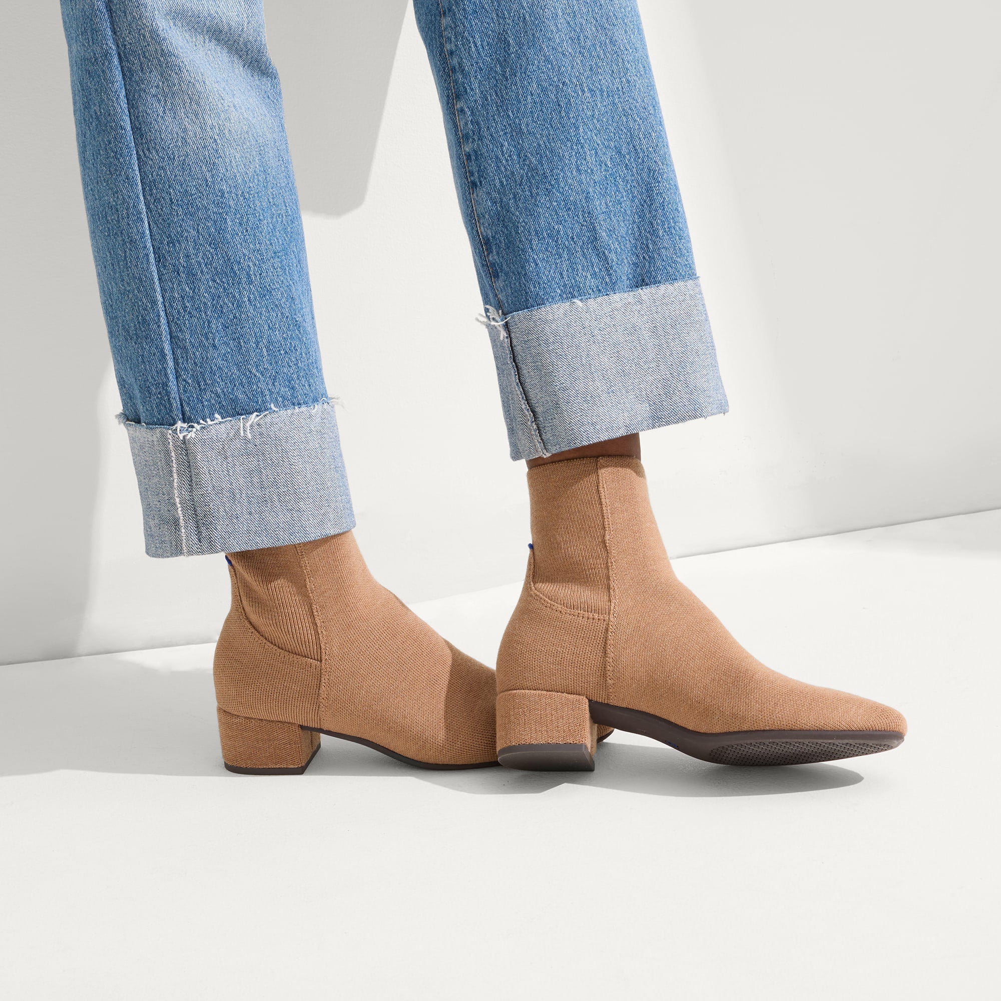 hover | Model wearing The Classic Boot in Tobacco.