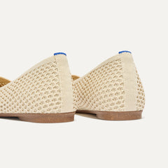 Close up of the heel of The Max Square in Off White Mesh with Rothy's signature blue halo.