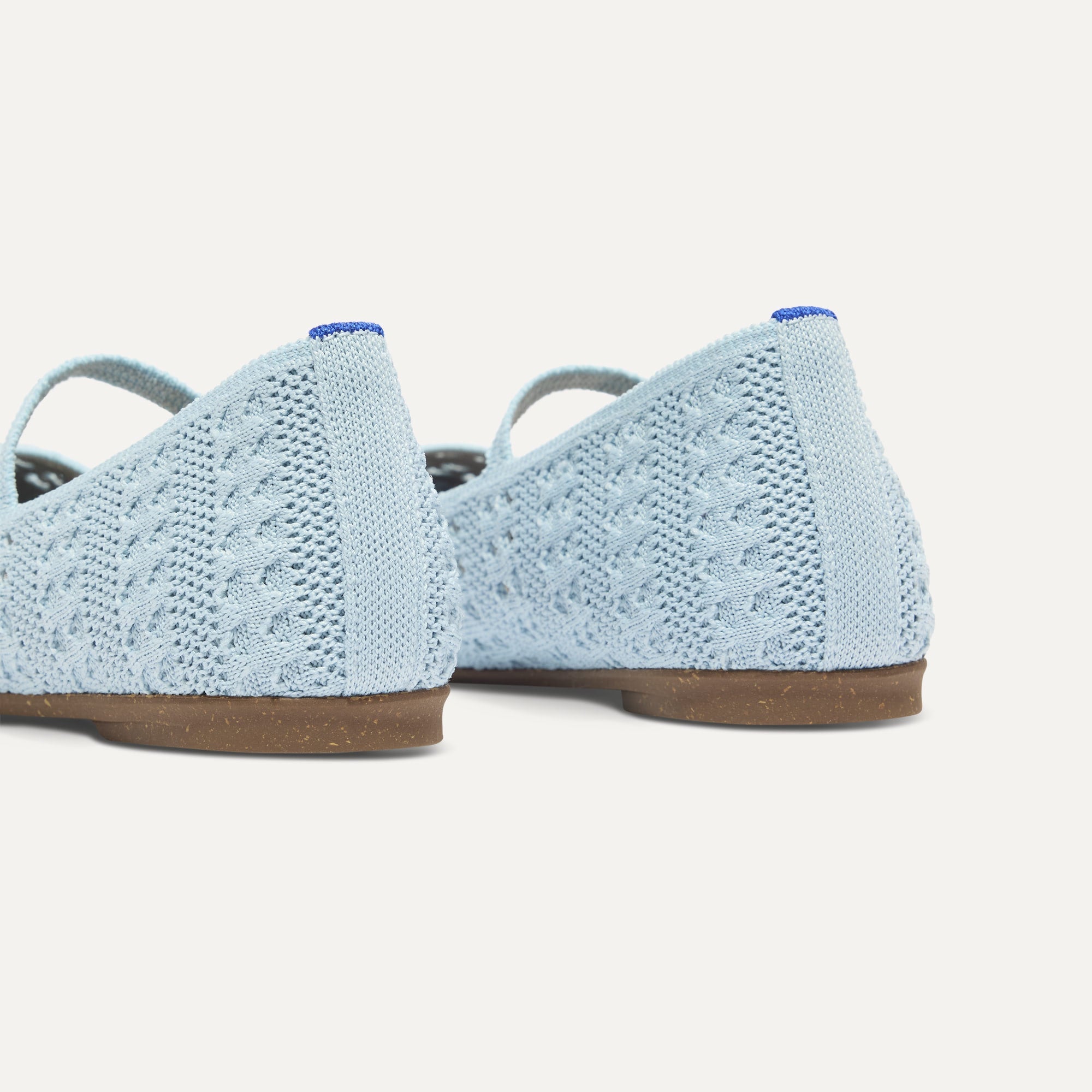 Close up of the heel of The Max Square Mary Jane in Powder Blue Crochet, with Rothy's signature blue halo.