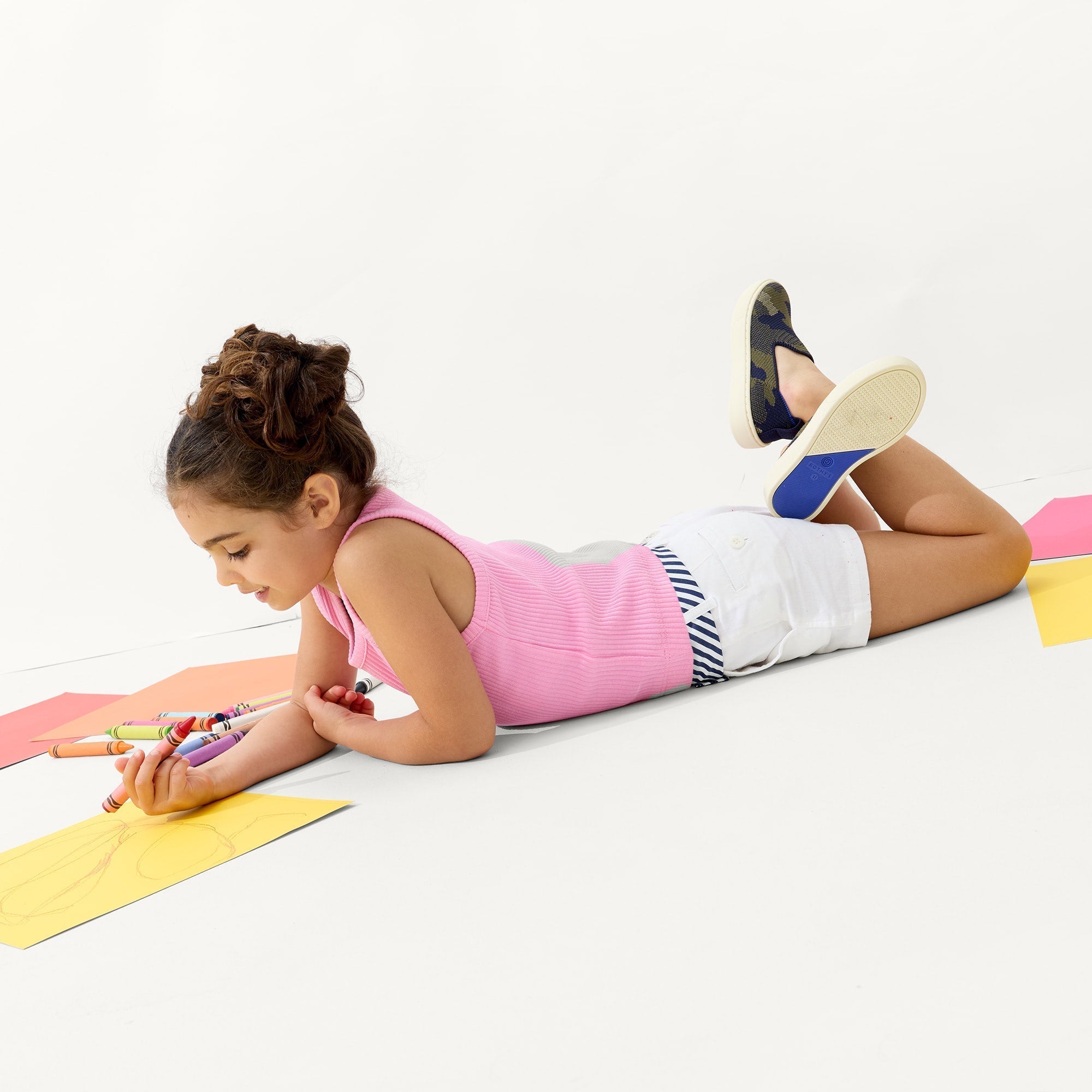 model | Alternate view of a model wearing The Kids Sneaker in Spruce Camo.