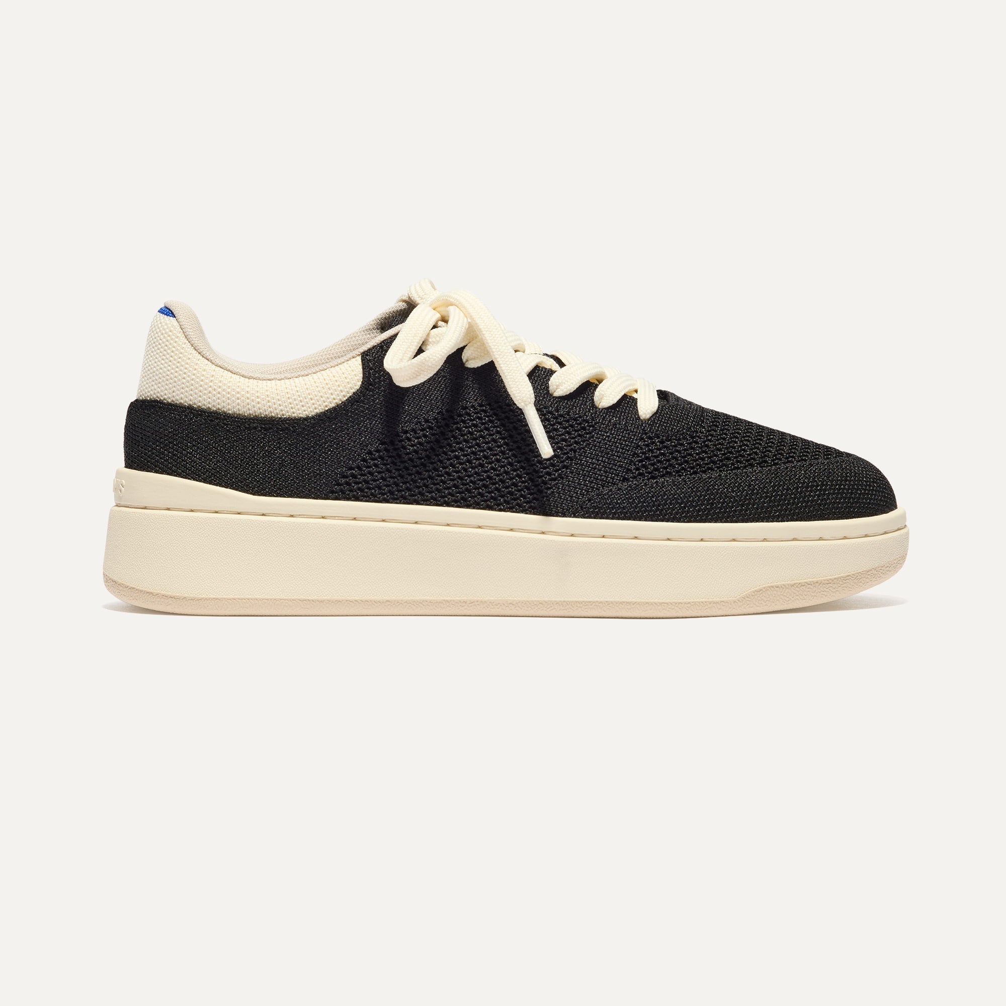 The Court Sneaker in Black shown from the side. 