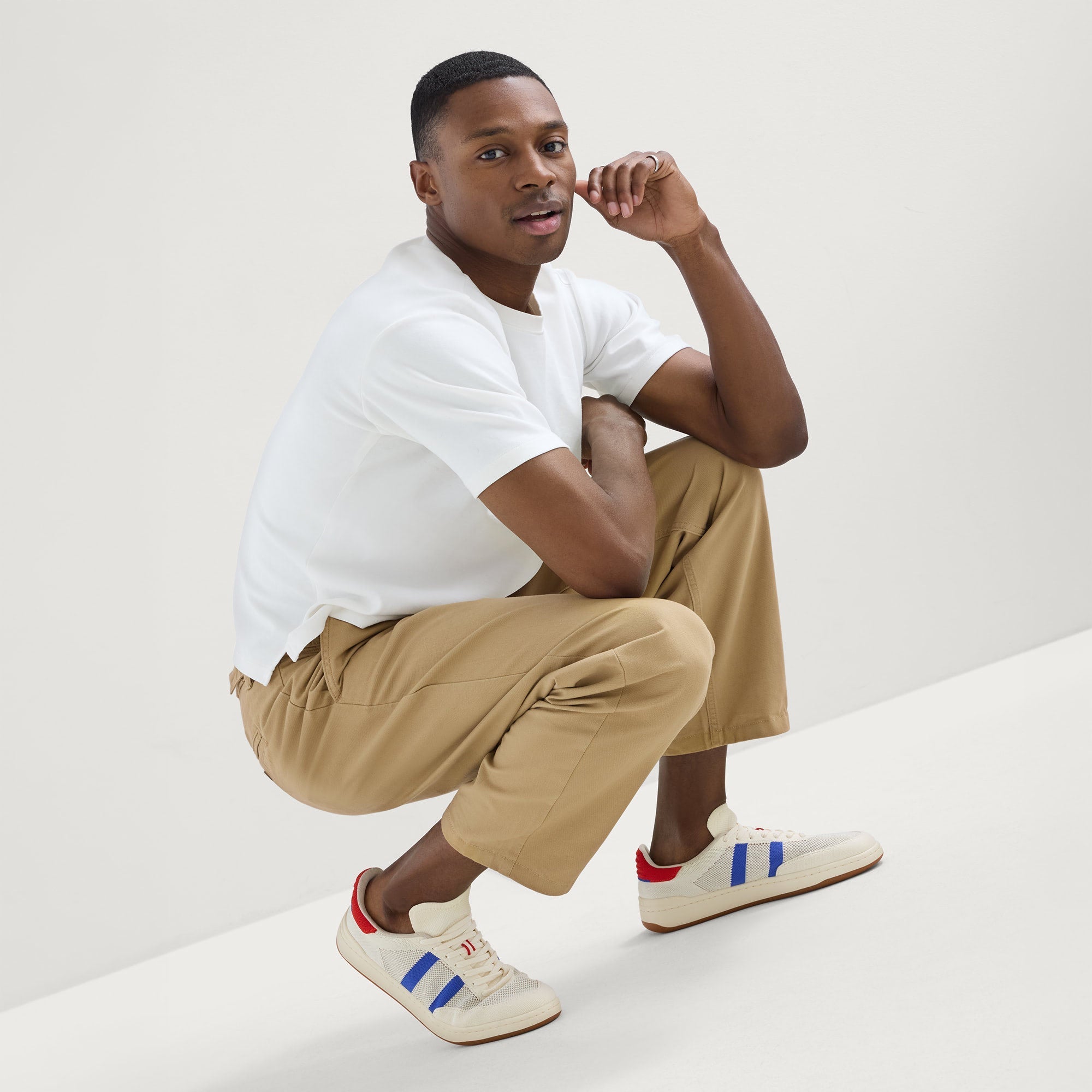 model | Alternate view of a model wearing The Men's Court Sneaker in Turbo Blue.