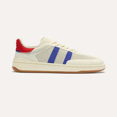 side | The Men's Court Sneaker in Turbo Blue shown from the side. 