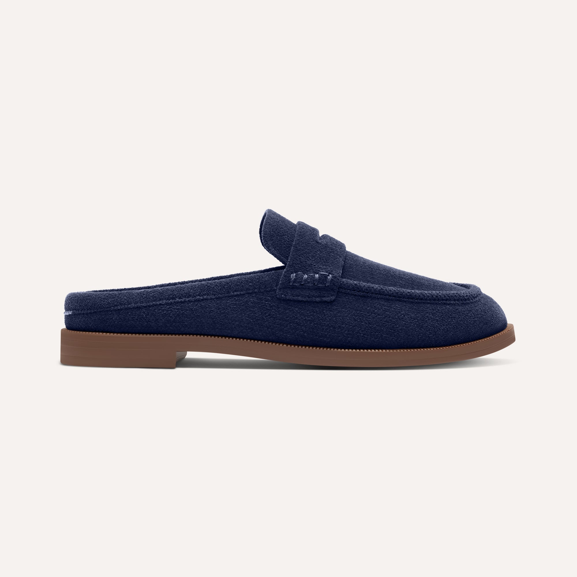 side | The Penny Loafer Mule in ReVelvet Navy shown from the side.