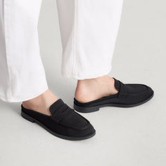hover | Model wearing The Penny Loafer Mule in Black.