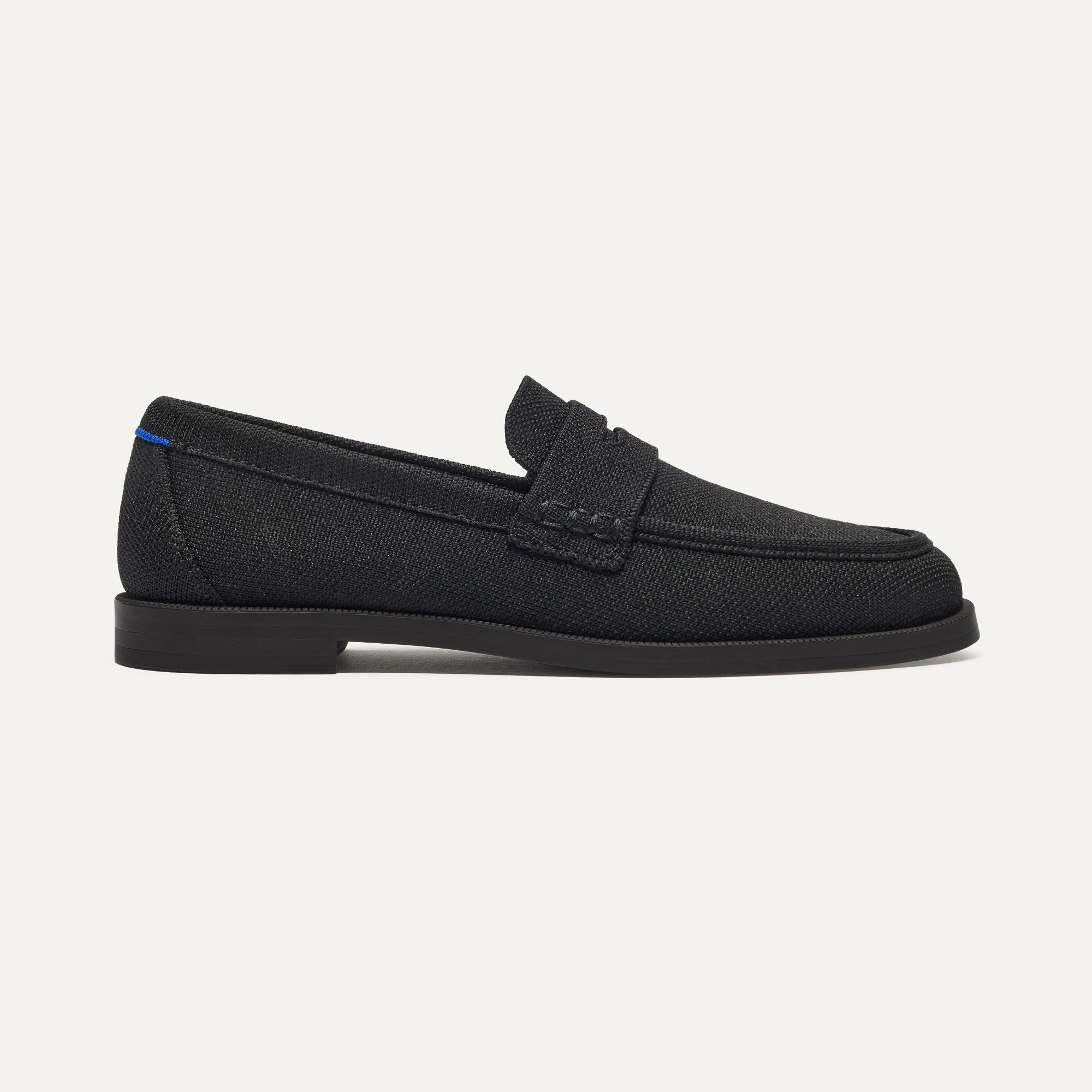 side | The Penny Loafer in Black shown from the side.