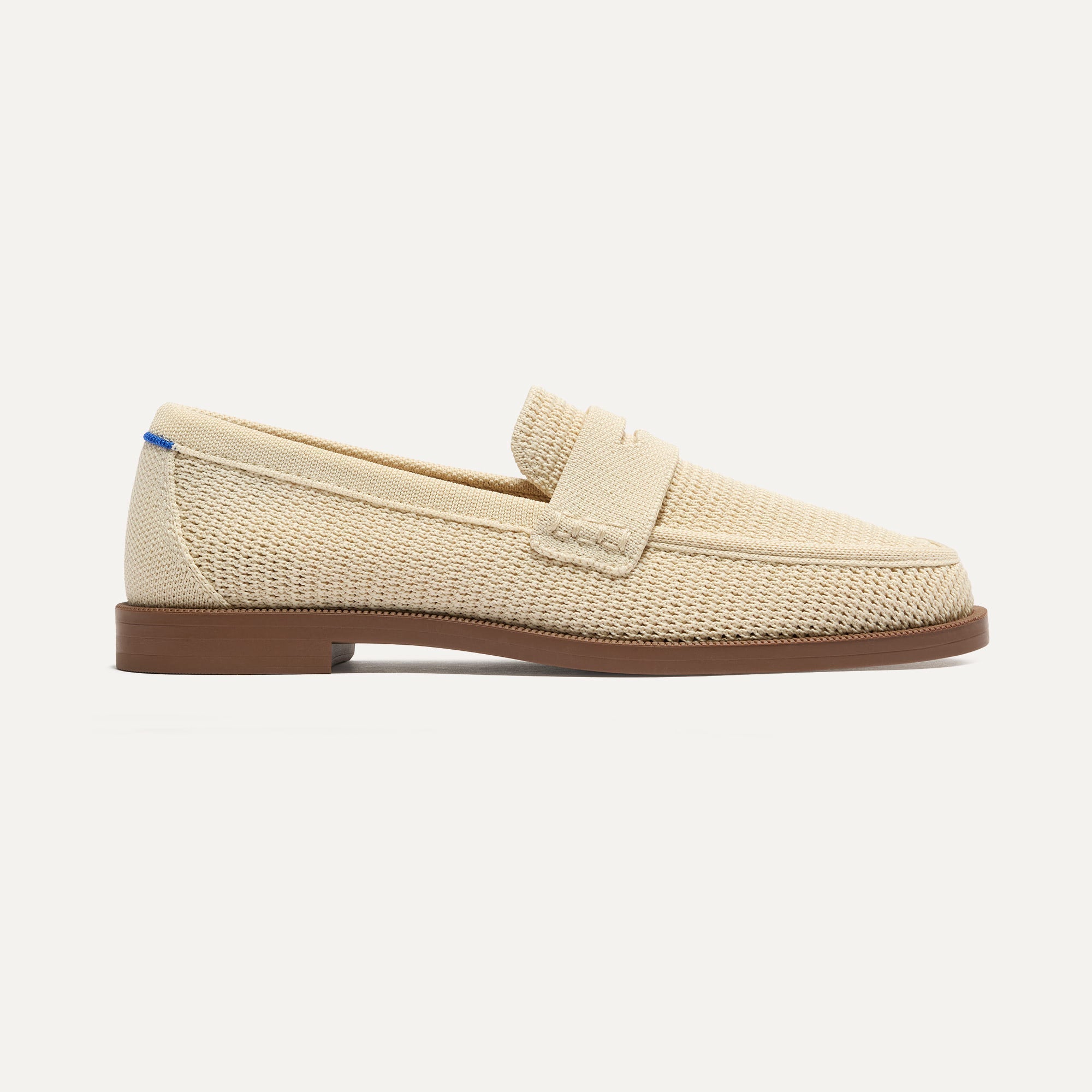 side | The Penny Loafer in Conch Raffia-Knit shown from the side.