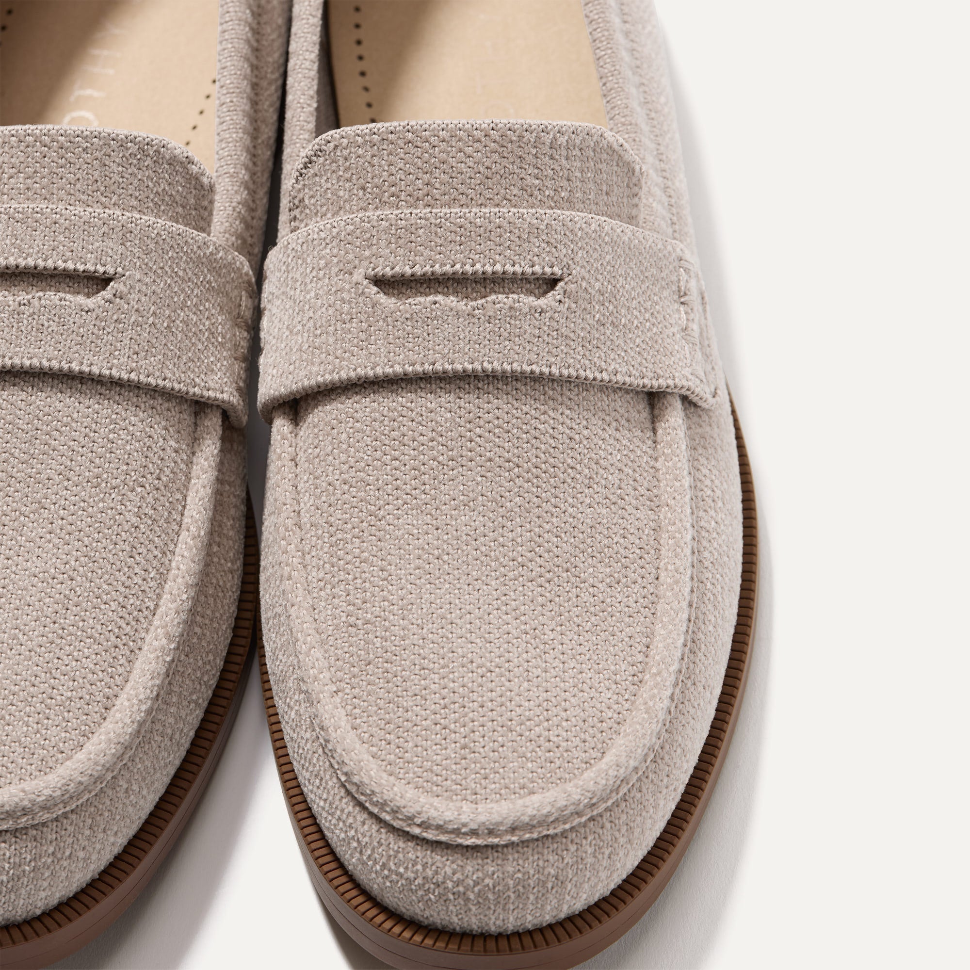 Close up of the toe box and penny keeper of The Penny Loafer in ReVelvet™ Dove.