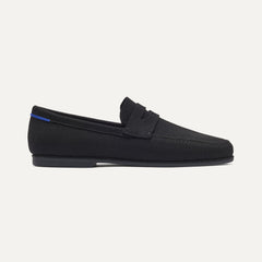 side | The Ravello Penny Loafer in Black shown from the side. 
