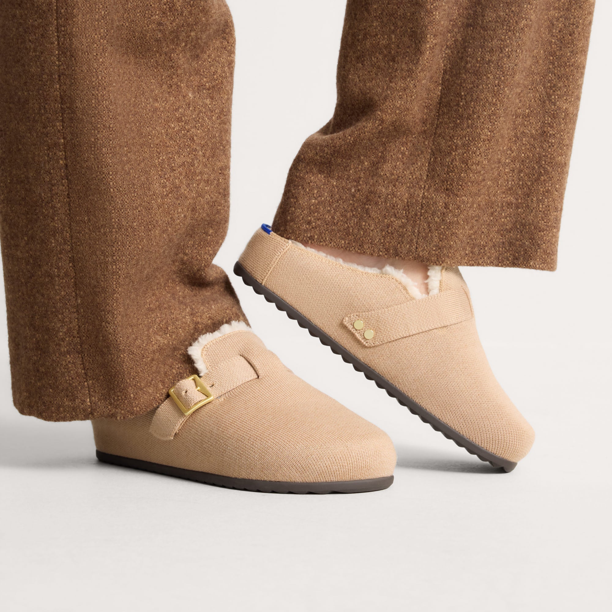 hover | Model wearing The Teddy Buckle Clog in Honey.