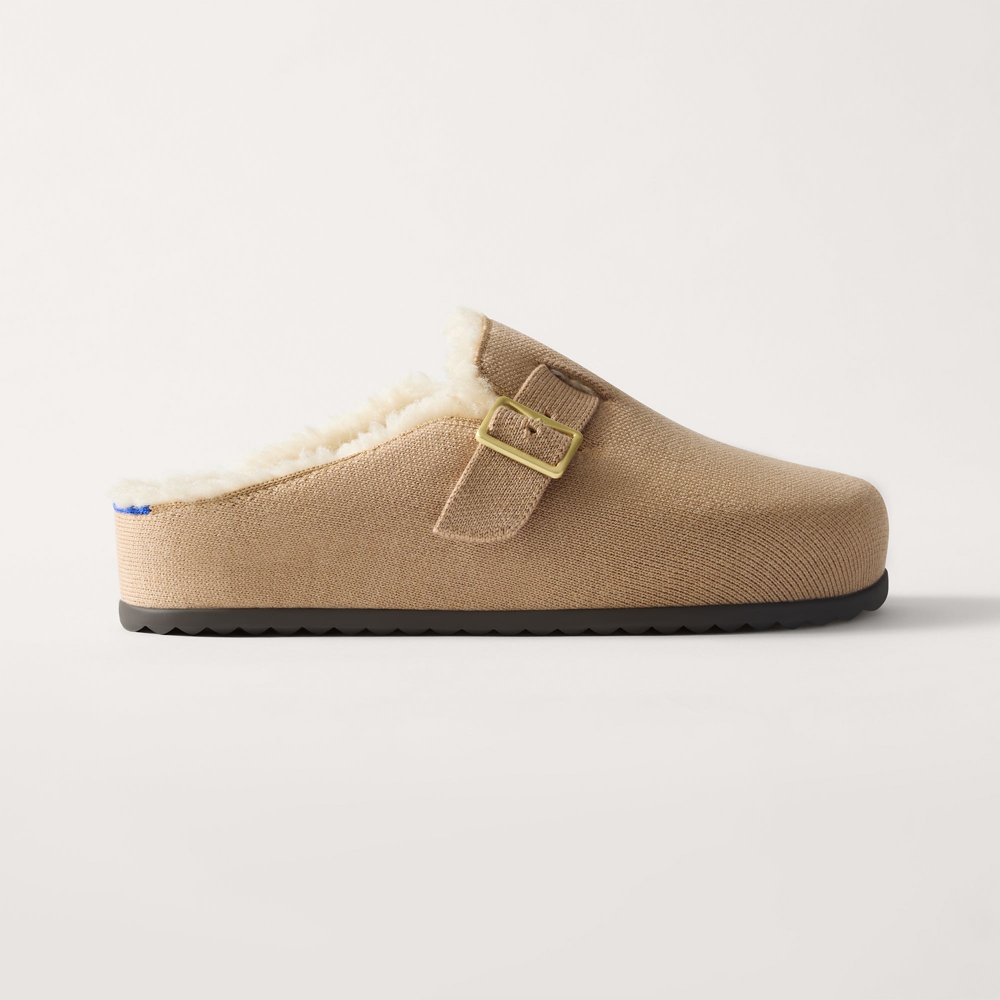 side | The Teddy Buckle Clog in Honey shown from the side.