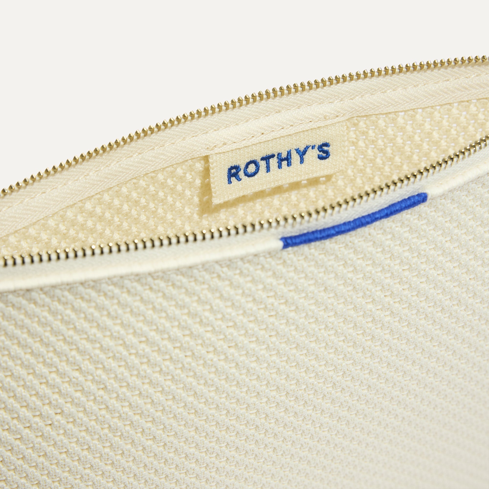 The Convertible Clutch in Love Bird Open-Knit, shown open from the top in diagonal view.