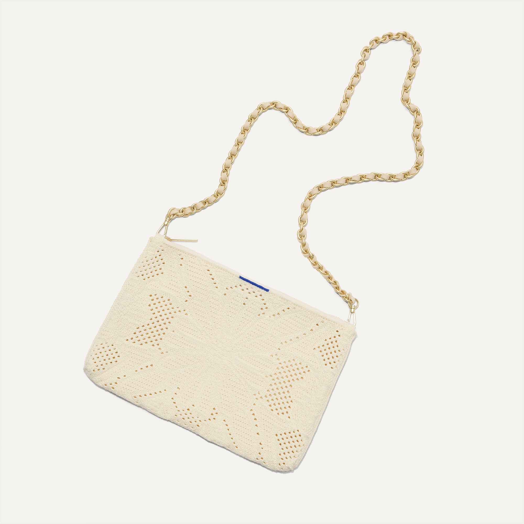 hover | Overlay::Shown with The Crossbody Strap (sold separately). | Alt:: The Convertible Clutch in Moonflower shown with The Crossbody Strap.