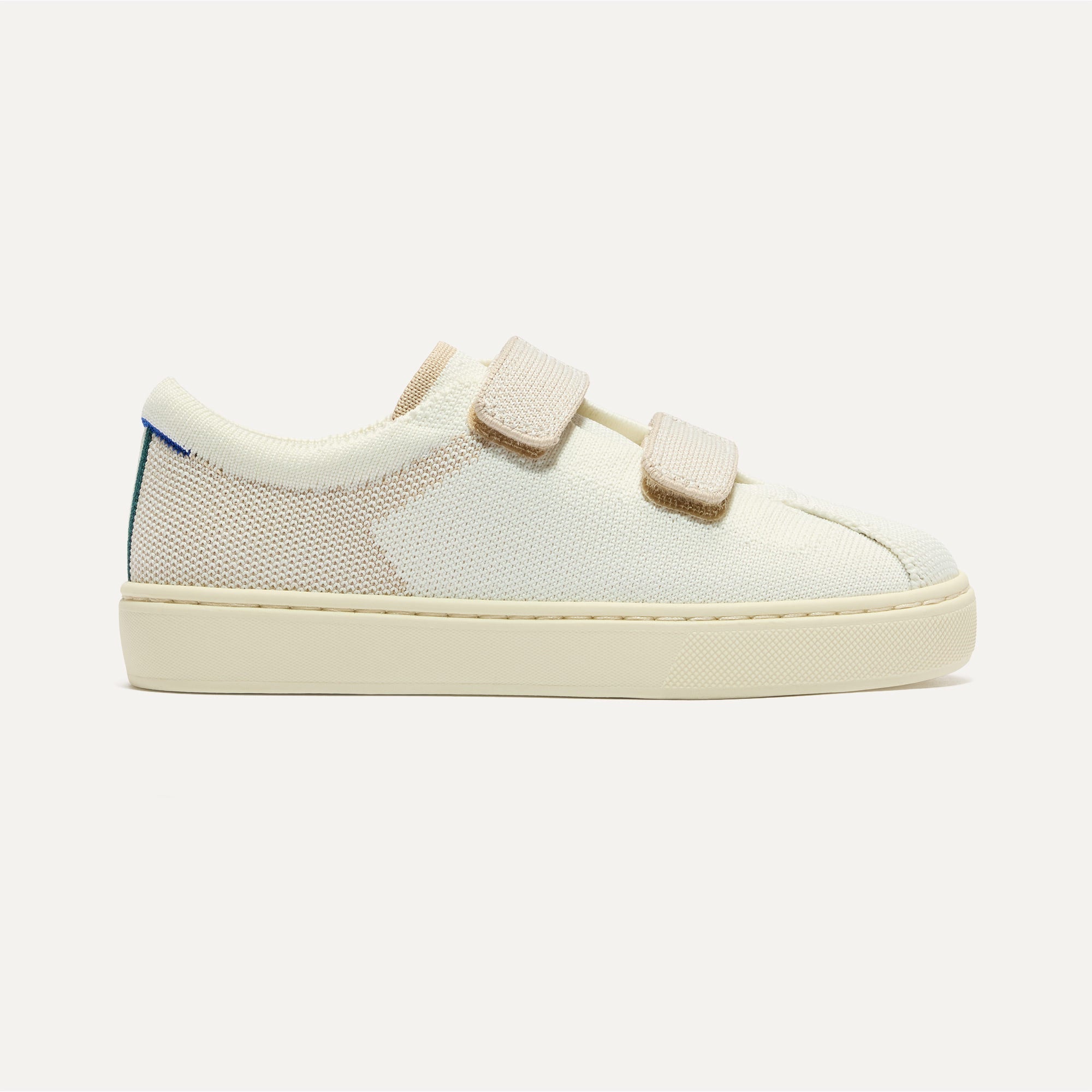 side | The Kids Strap Sneaker in Vanilla Ice shown from the side. 