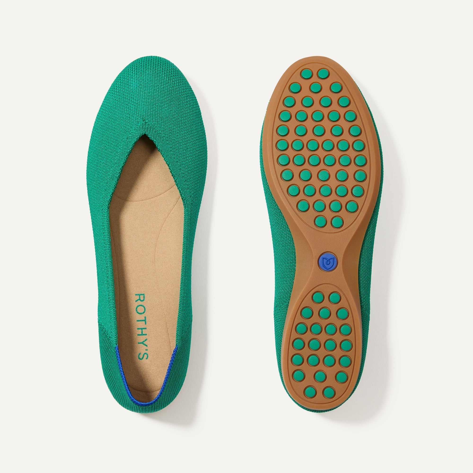 PLP | The Daily Flat in Clover shown from the top with one shoe showing the outsole. 