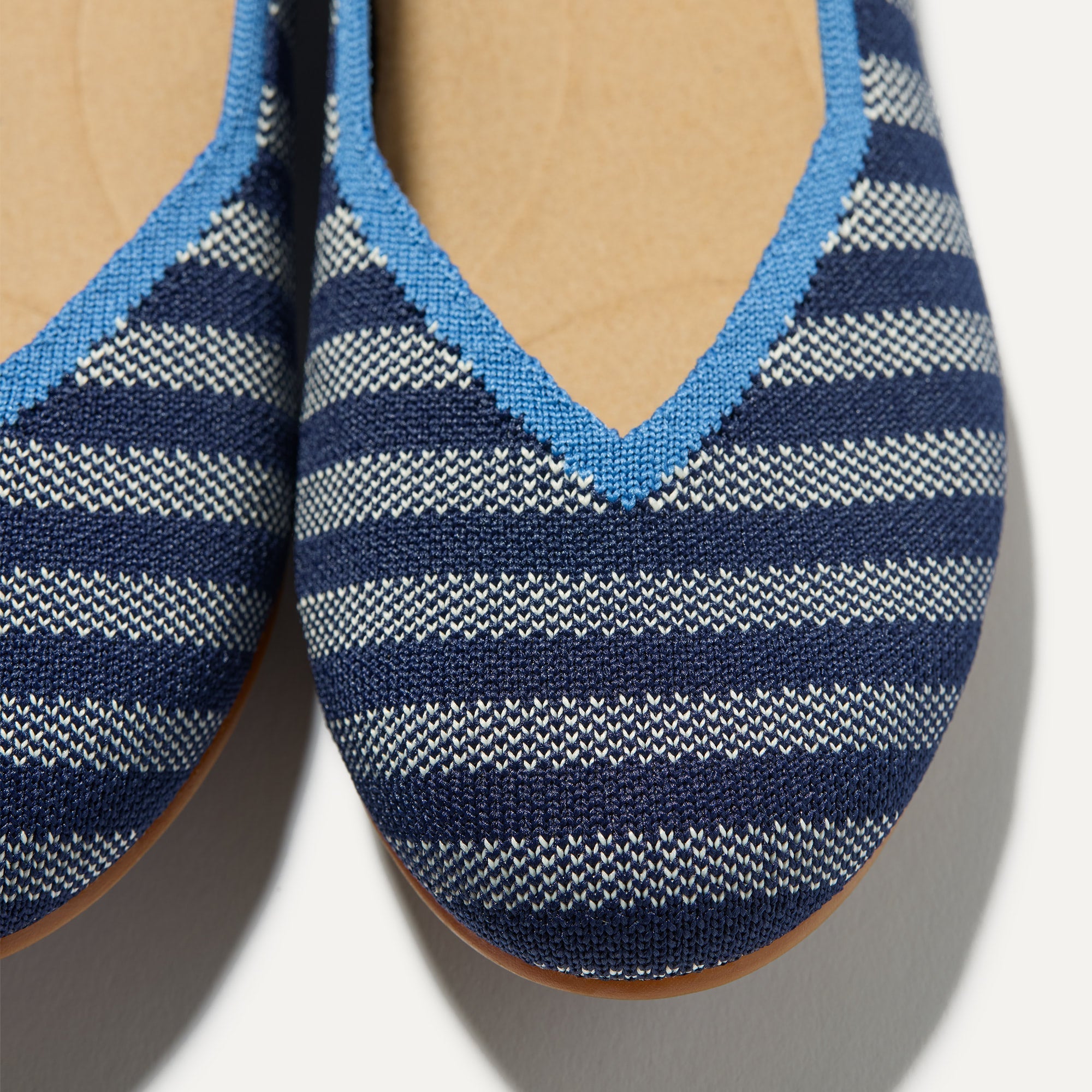 Close up of the toe and vamp of The Daily Flat in Harbor Cabana Stripe. 
