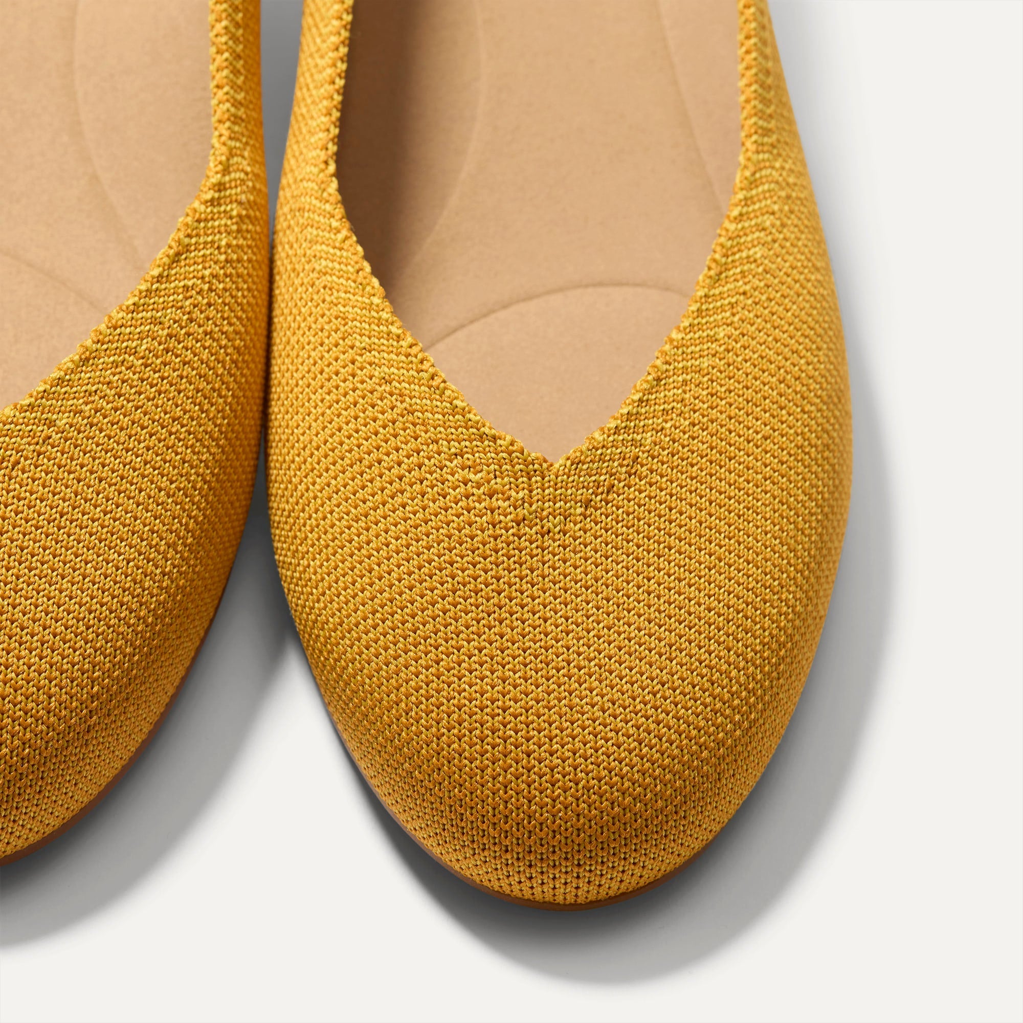 Close up of the toe and vamp of The Daily Flat in Marigold. 