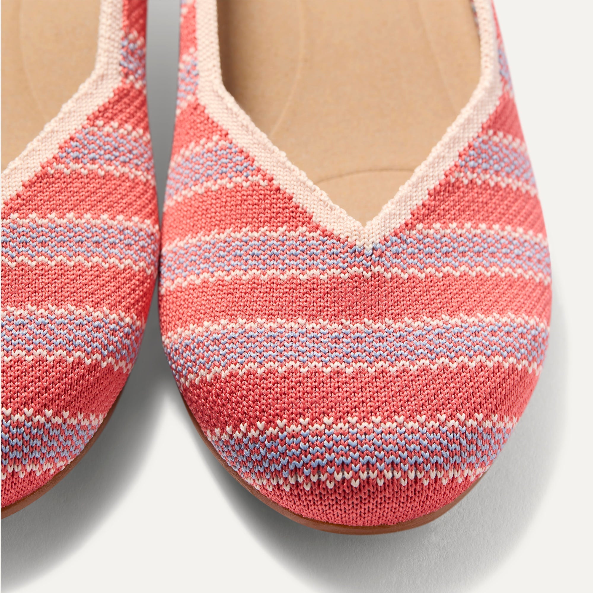 Close up of the toe and vamp of The Daily Flat in Sunkiss Stripe. 