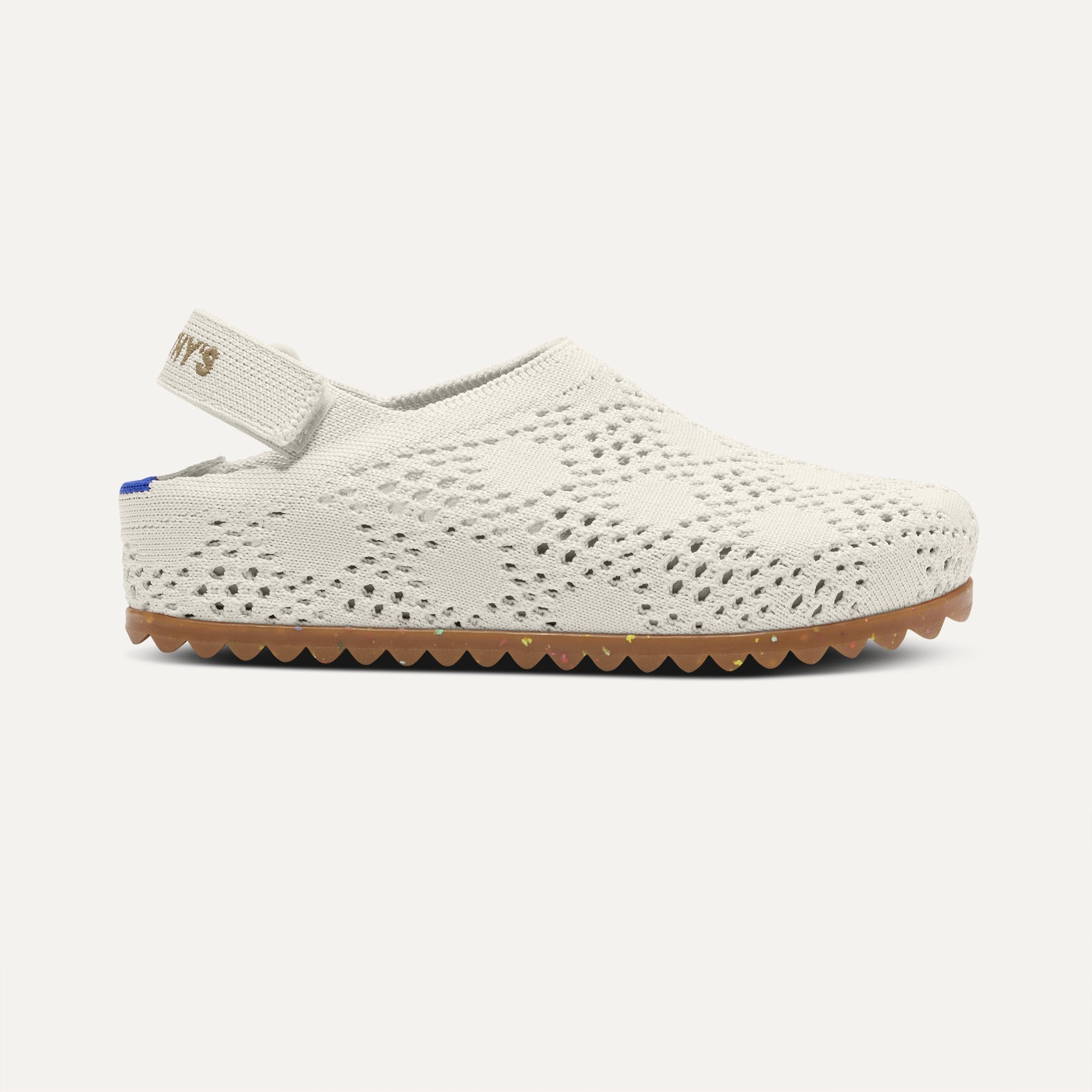 side | The Kids Clog in White Crochet shown from the side. 