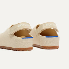 Close up of the back heel strap of The Kids Clog in Conch.