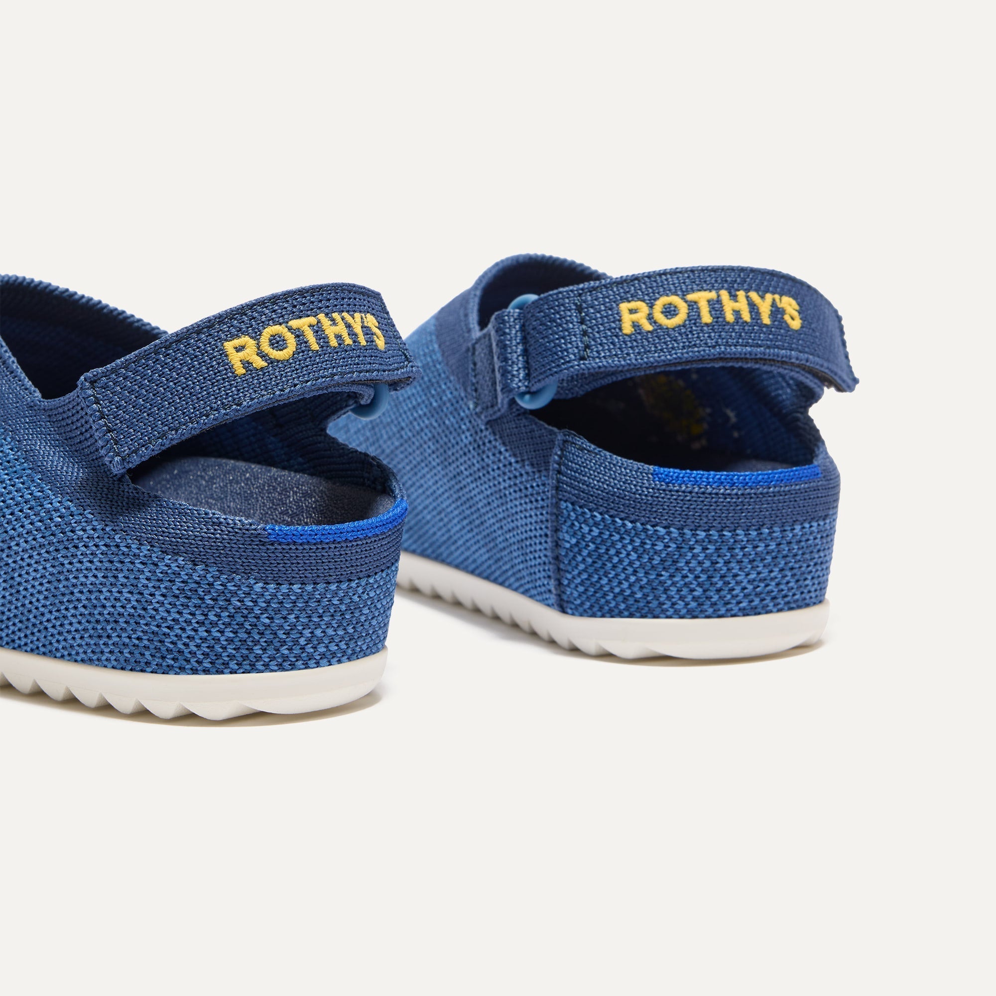 Close up of the heel of The Kids Clog in Indigo Daisy, with Rothy's signature blue halo. 