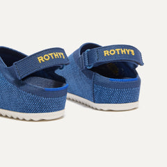 Close up of the heel of The Kids Clog in Indigo Daisy, with Rothy's signature blue halo. 