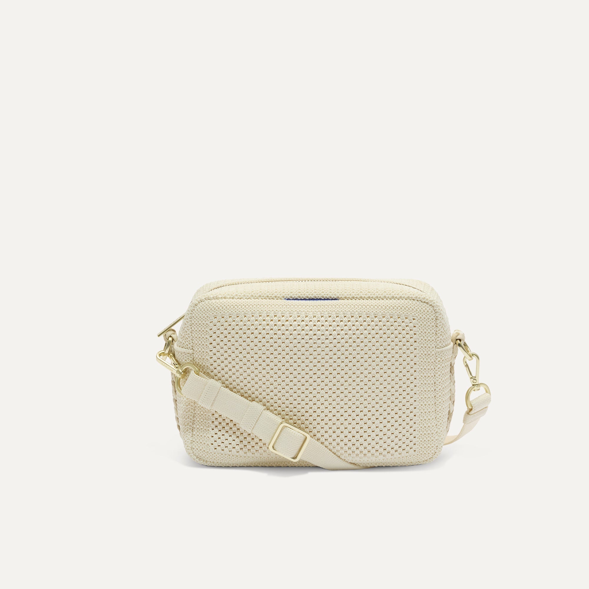 PLP |The Crossbody Camera Bag in  Cream Twist Open-Knit, shown from the front. 