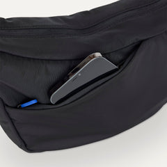 The Travel Sling in Ink  shown closed from the top showcasing the side pocket.