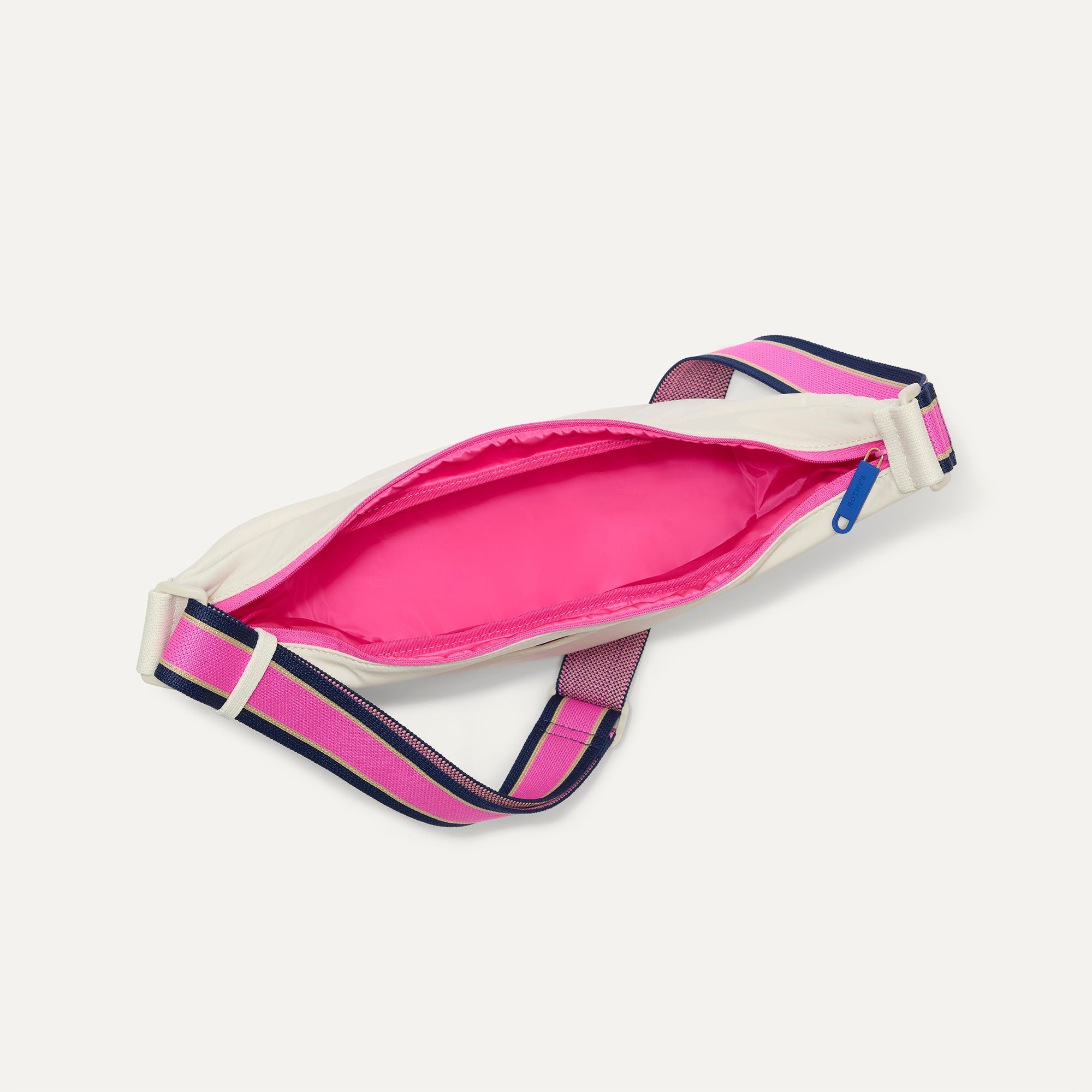 The Travel Sling in Optic shown from the top down, with zipper open and interior exposed.