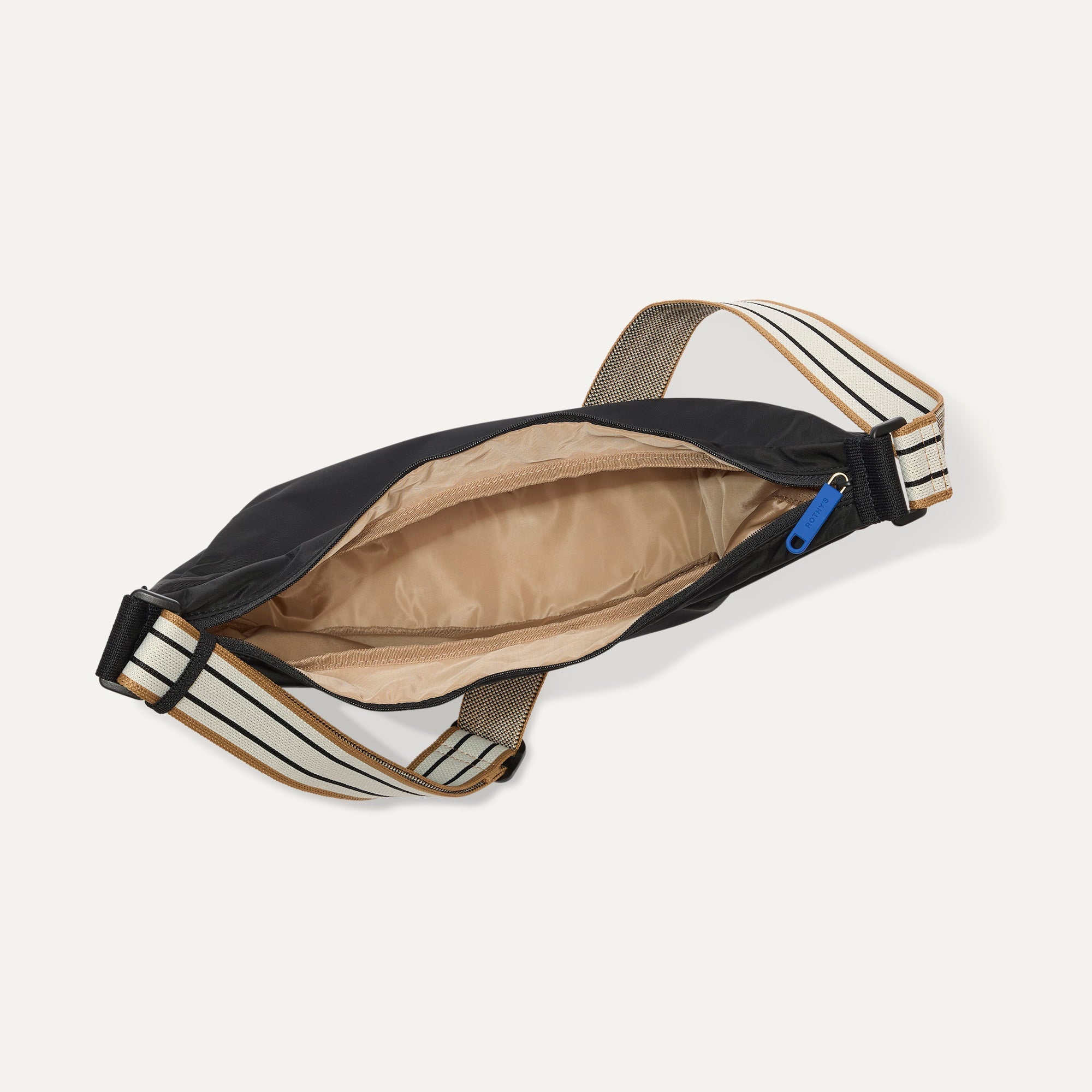 The Travel Sling in Ink shown from the top down, with zipper open and interior exposed.