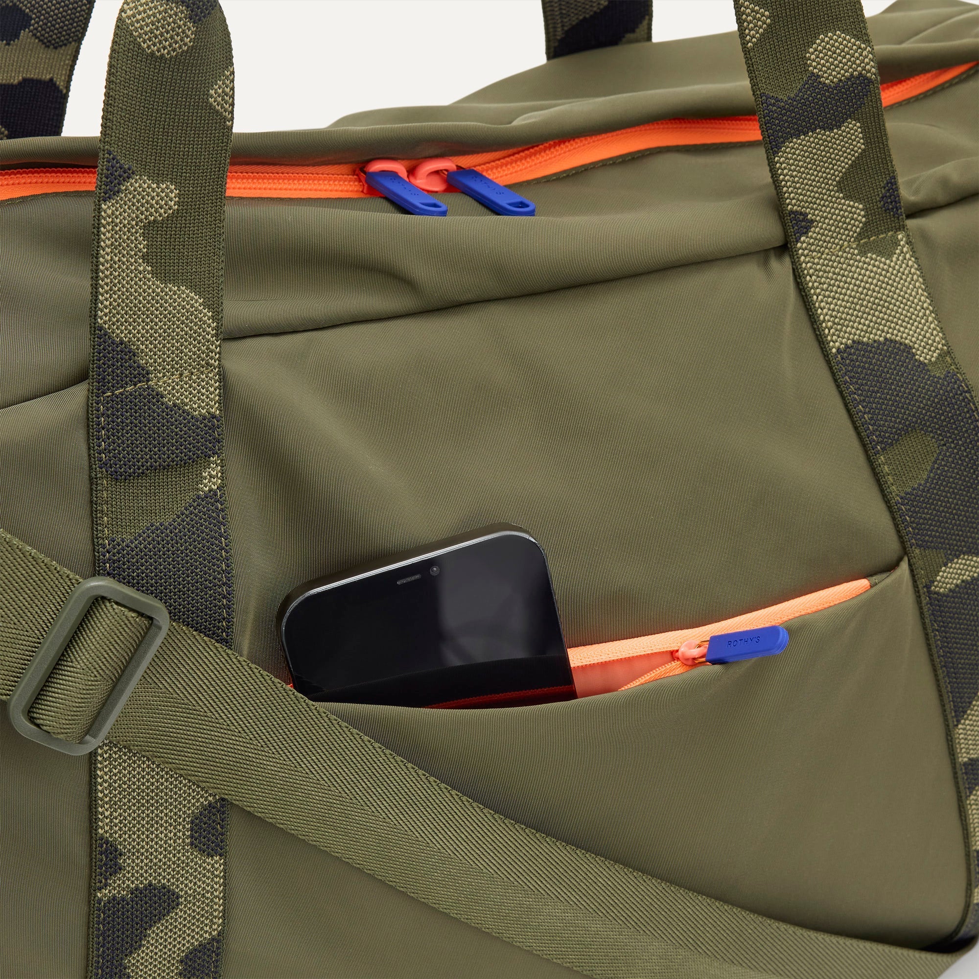The Travel Duffle in Forest shown closed from the top, focusing on the side pocket. 
