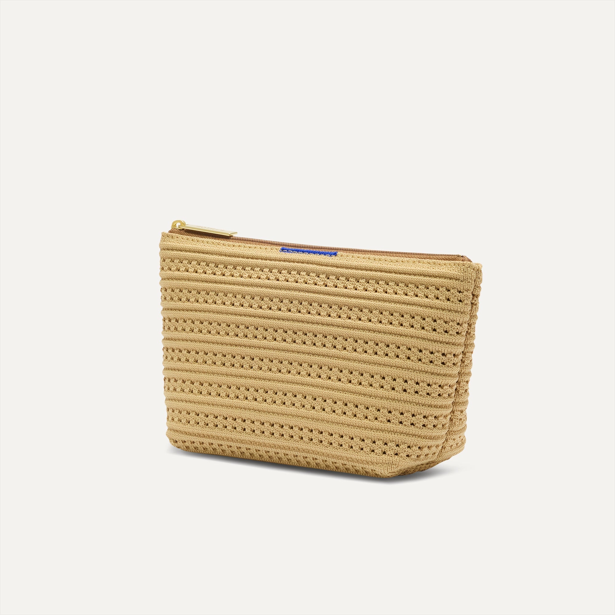 The large pouch of The Vanity Set in Volley shown in diagonal view. 